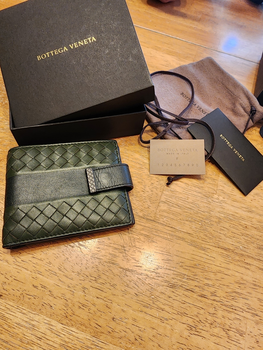 Bottega Veneta Intrecciato Club Lamb wallet in dark green signature woven Design